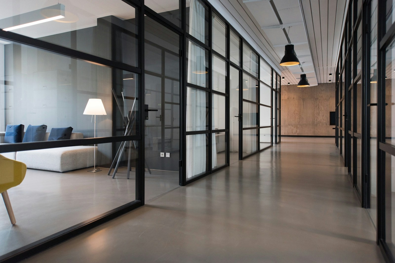 A modern office with glass partitions and natural light